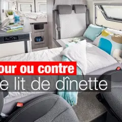 Aménagement intérieur d'un camping-car avec un lit de dînette transformé, prêt pour le repos.